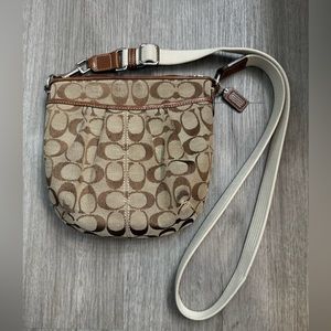 Signature Coach crossbody bag (H: 7”x L: 8”x W: 2”) Tan/Brown.